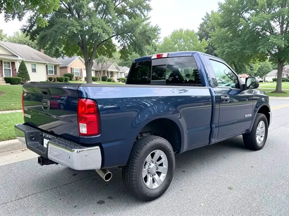 AI-drawn sample: a dark blue pickup truck seen from the rear left corner, with a chrome rear bumper, parked on a suburban street with houses and trees behind
