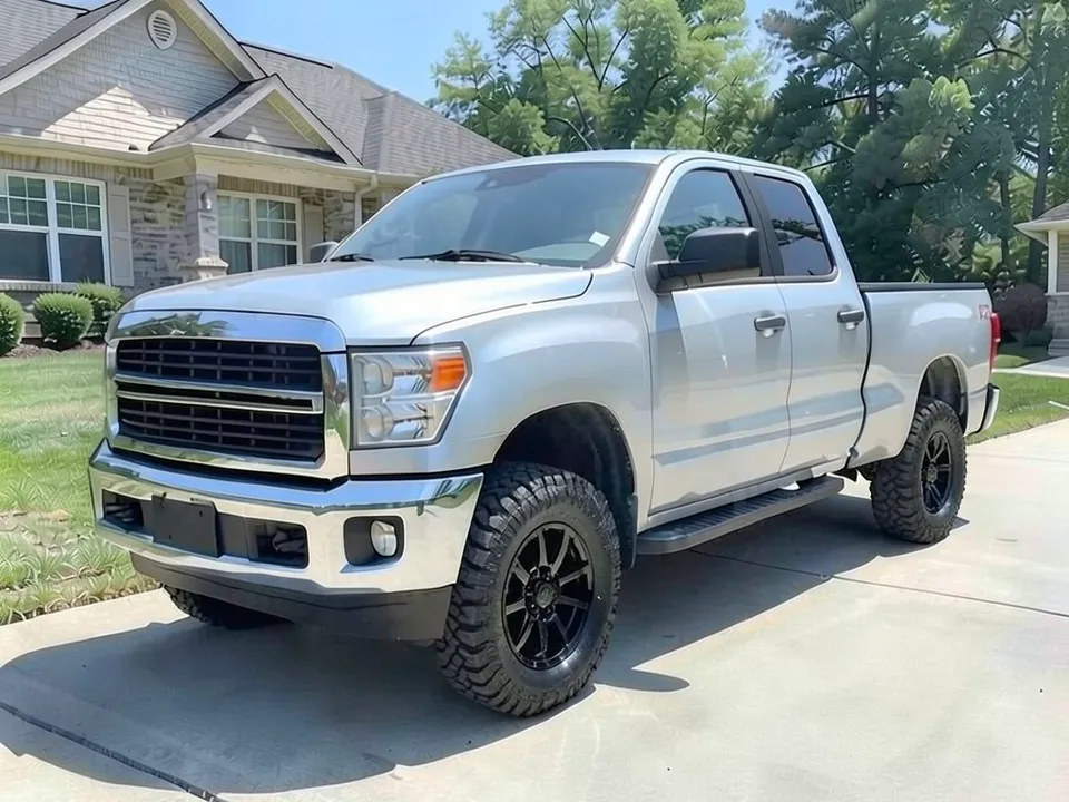 AI-generated sample: a silver crew cab pickup with black wheels