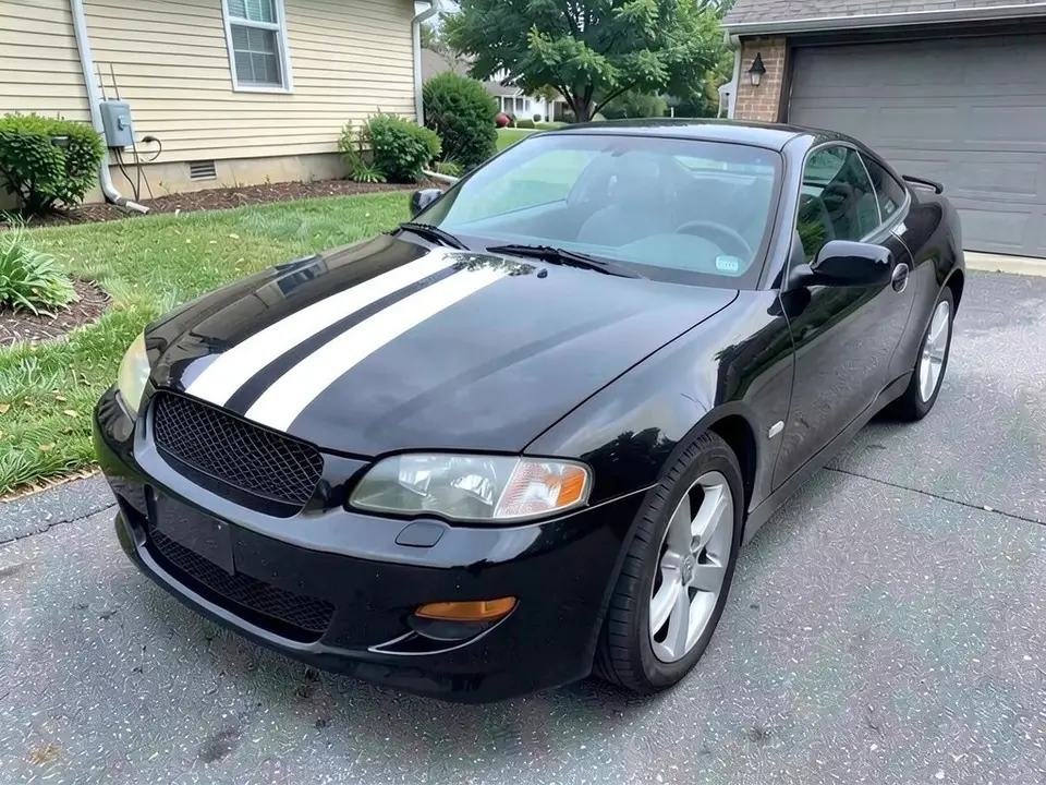 AI-generated sample: a black coupe with white racing stripes